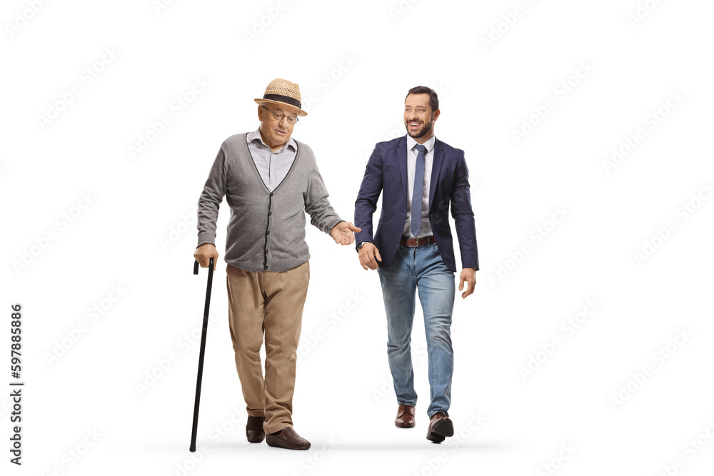 Elderly man walking and talking to a younger man Elderly man walking and talking to a younger man