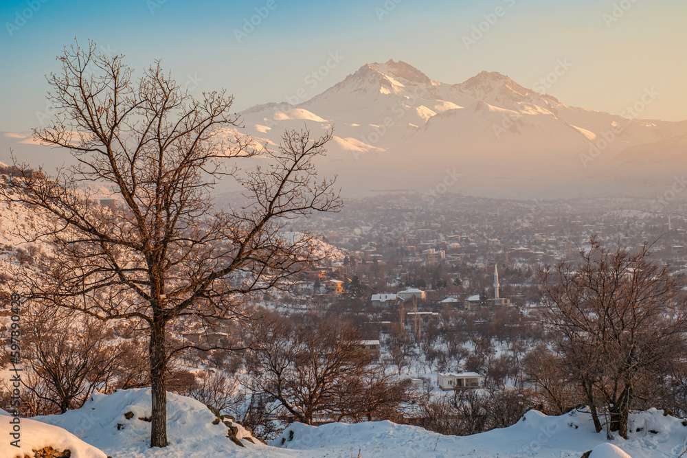 Erciyes Mount with from Kayseri. Height of 3,864 metres is the highest mountain in Cappadocia and central Anatolia. It is a volcano. Hacilar city - obrazy, fototapety, plakaty 