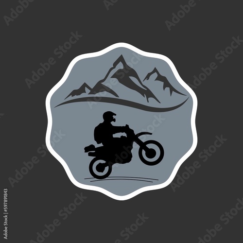 logo design motor cross passes through the mountain suitable for your logo design photo