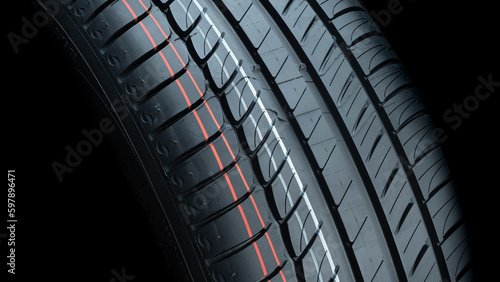 CLOSE UP OF TIRE TREAD FOR CAR GRIP FOR SAFETY. COPY SPACE FOR WORKSHOPS ADVERTISEMENT BROCHURES.