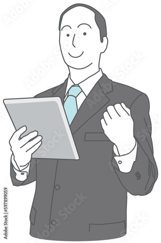 タブレット端末を持って握り拳をするスーツを着た男性