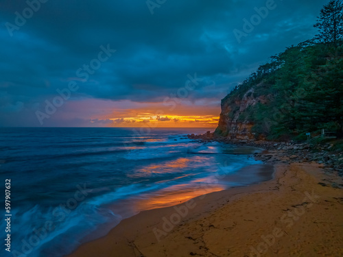 Rain clouds and sunrise at the seaside