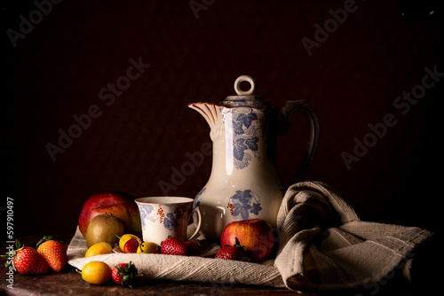 Bodegón con frutas, tetera y taza antigua photo