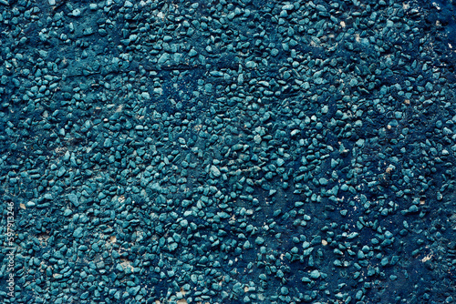 a wall of small stones of dark blue color