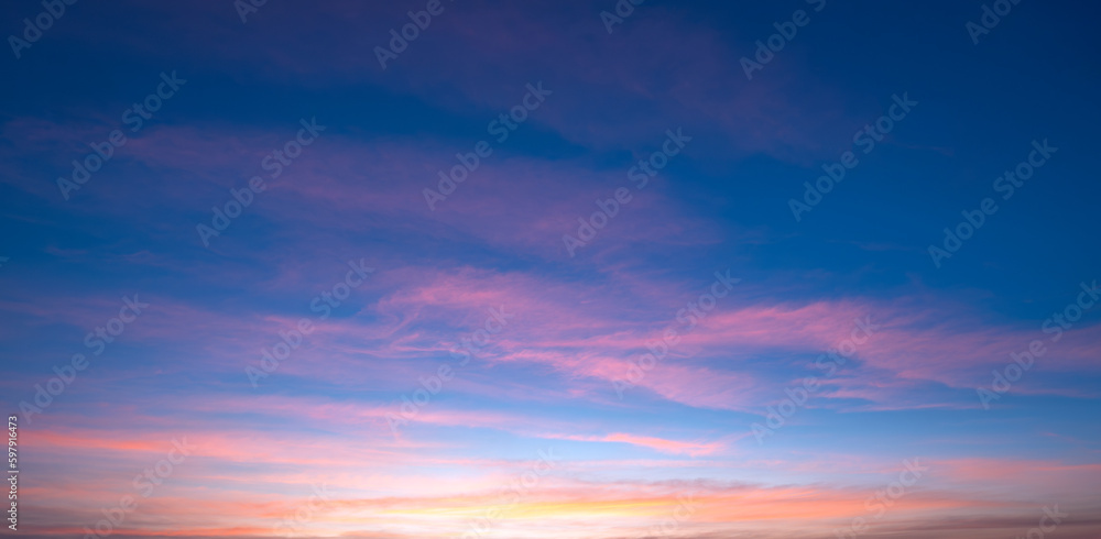 Beautiful Romantic Orange Sunset Clouds with sunlight on Dusk Sky Twilight background in Panoramic view