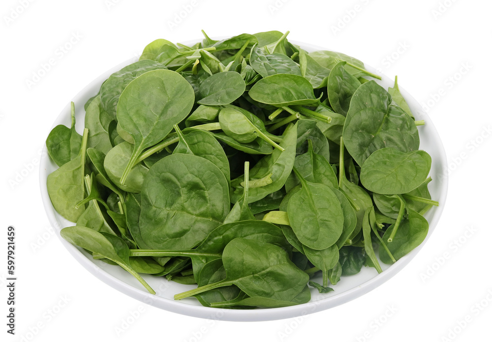 Bunch of fresh spring spinach leaves on a round plate Bunch of fresh spring spinach leaves on a round plate