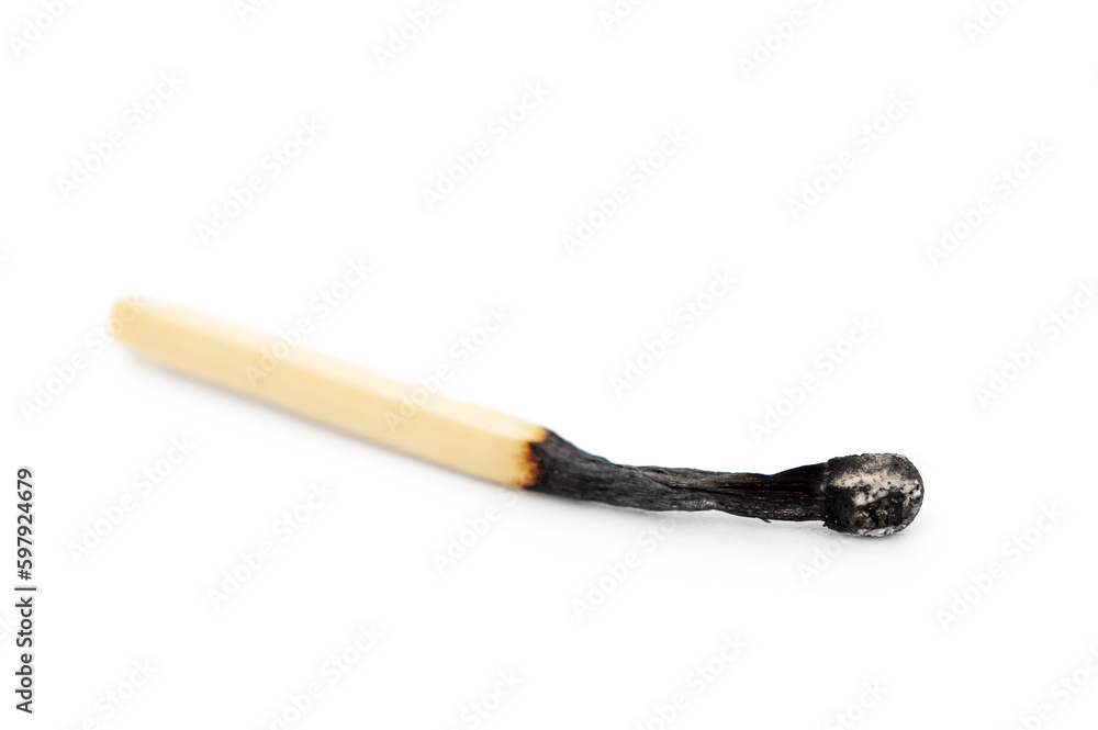 Burnt match on a white background. Close up. Burnt match on a white background. Close up.