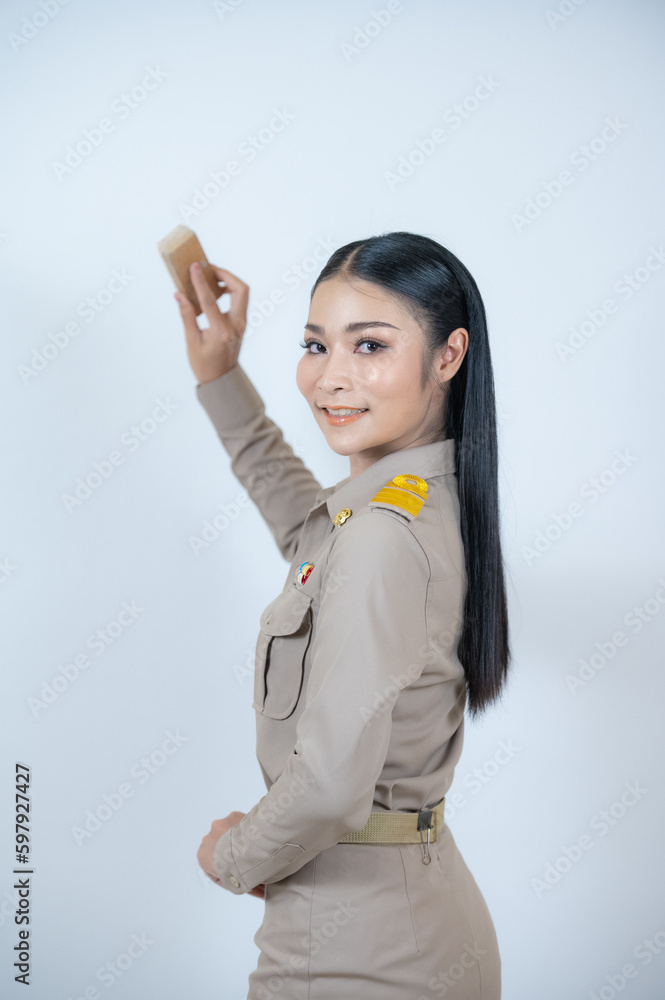 Asian woman in Thai government uniform pointing on empty space. Asian woman in Thai government uniform pointing on empty space.
