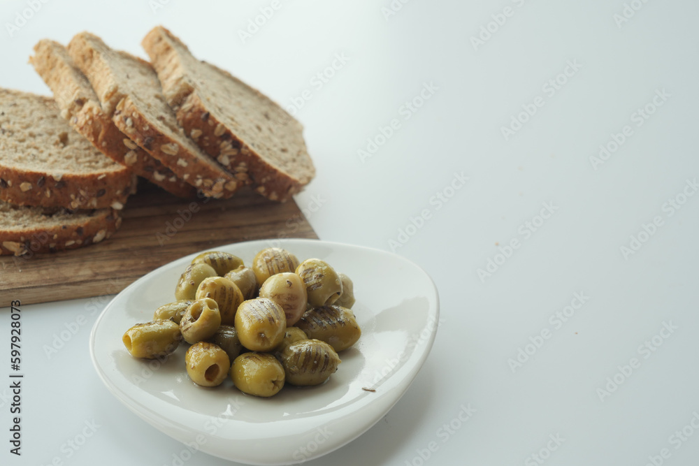 breads and Turkish Grilled olives on white background 