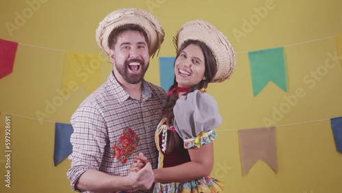 Brazilian couple, dressed in Junina party clothes, São João party. Protocol scenes.