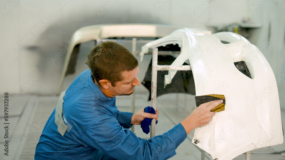 Closeup male mechanic hand, who is sloppy wiping parts car, removed clean, Before being sprayed