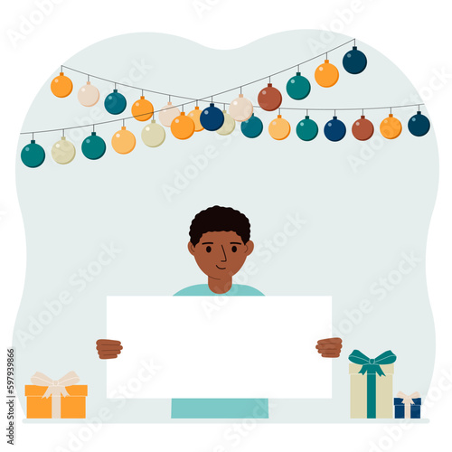 Celebration concept with garland, gift boxes and poster. A little boy smiles, rejoices and celebrates a birthday, name day, or a festive event.