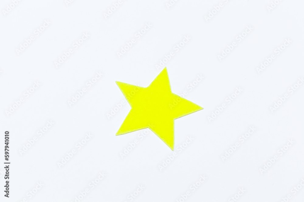 Yellow felt stars of different sizes on a white background. isolate Yellow felt stars of different sizes on a white background. isolate