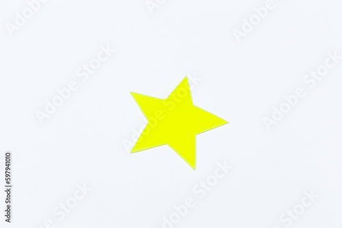 Yellow felt stars of different sizes on a white background. isolate
