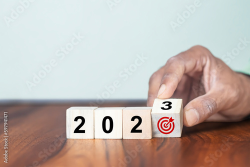2023 goals of business or life. Team building. Wooden cubes with 2023 and goal icon. Starting to new year. Business common goals for planning new project, annual plan, business target achievement