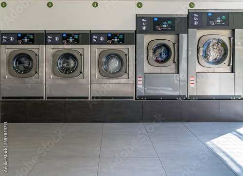 Slika na platnu Washing machines in an urban city laundry for washing and drying clothes, sheets