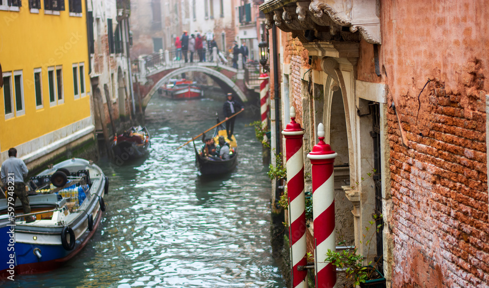 gondolas and boats in the narrow canals of Venice