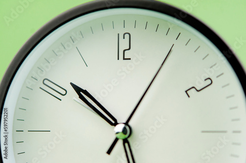 clock precious time alarm clock on green background concept of time working with time