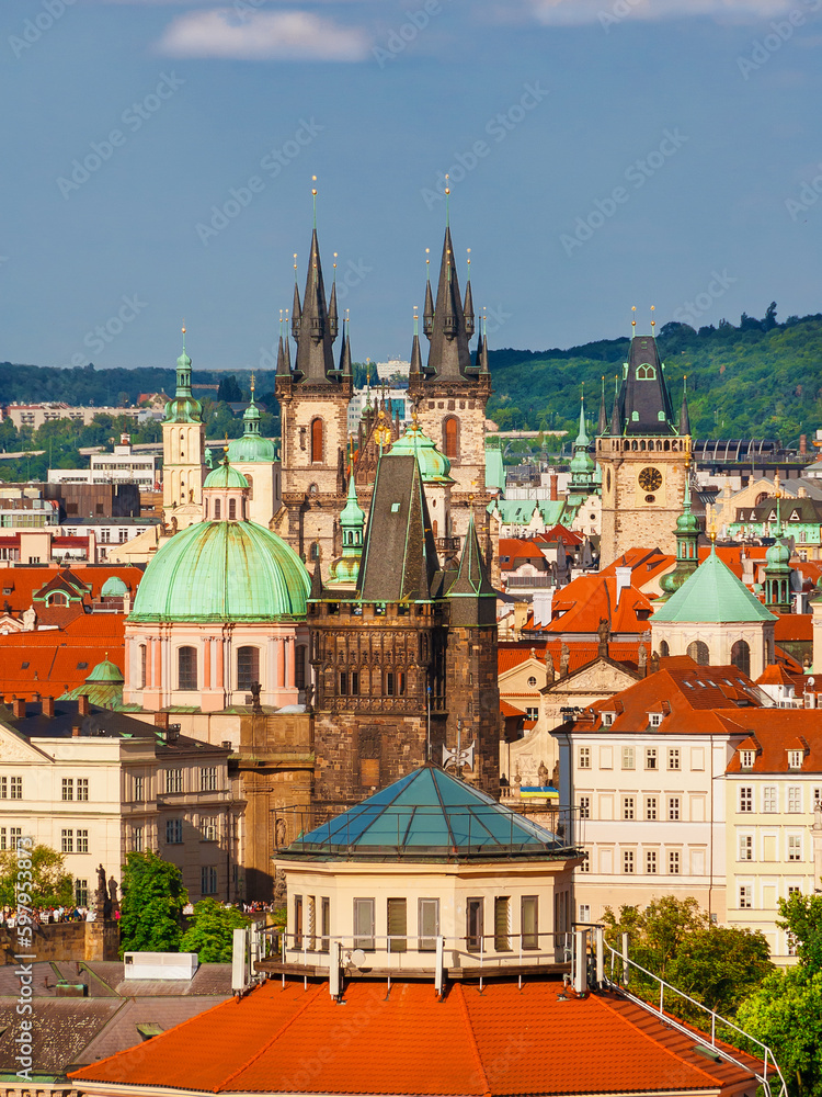 Prague historical center old skyline with famous churches and Charles Bridge tower