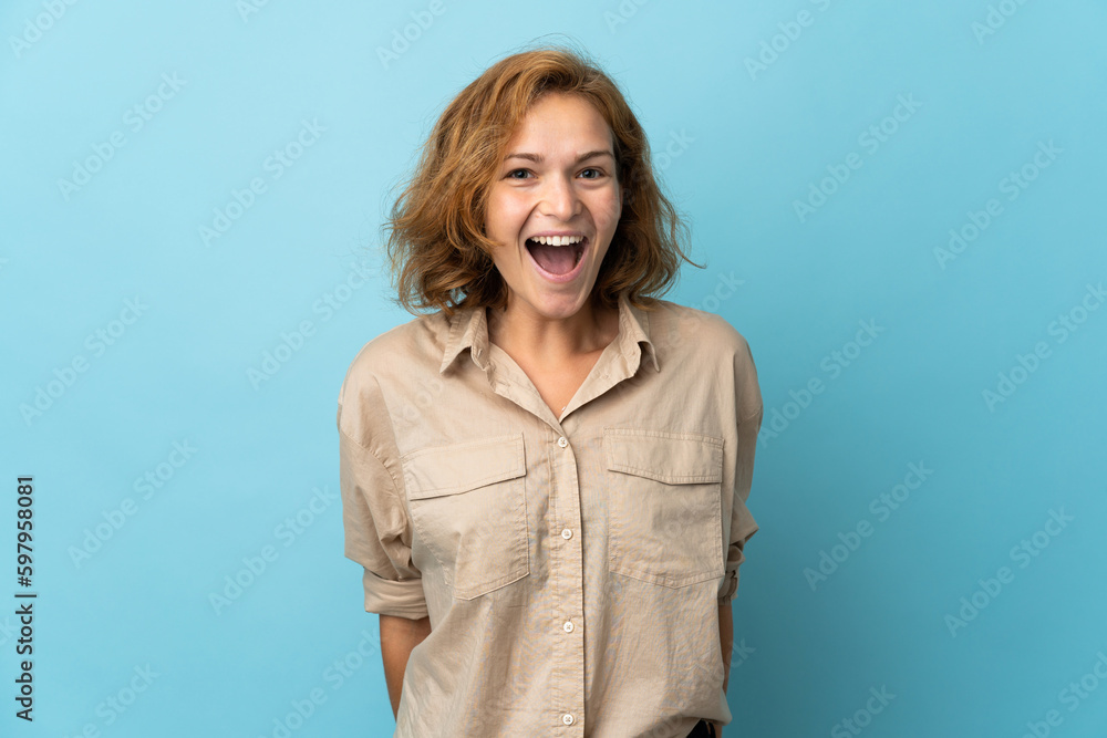 Obraz premium Young Georgian woman isolated on blue background with surprise facial expression