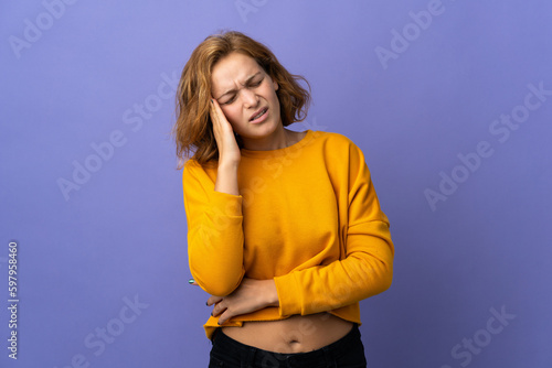 Young Georgian woman isolated on purple background with headache