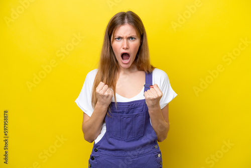 Young caucasian woman isolated on yellow background frustrated by a bad situation