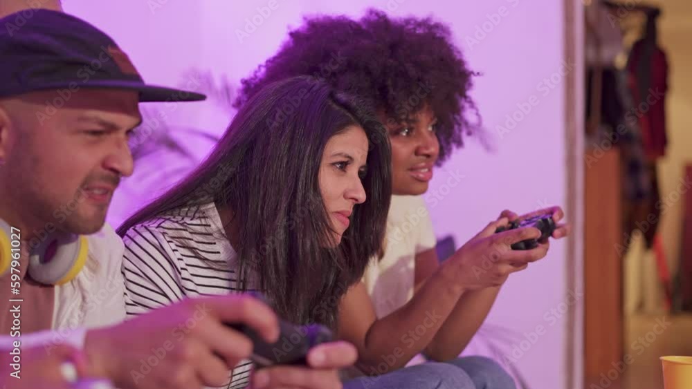 Woman celebrating that beat friends in a console game Woman celebrating that beat friends in a console game
