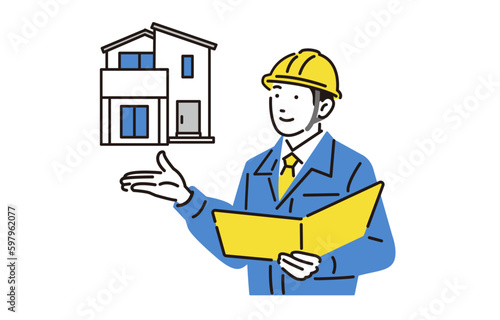 戸建てと作業服の男性