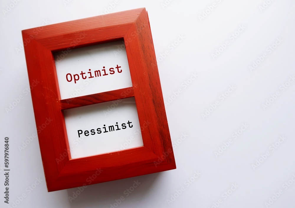 Fotografie Photo frame on copy space background with text written OPTIMIST and PESSIMIST -
