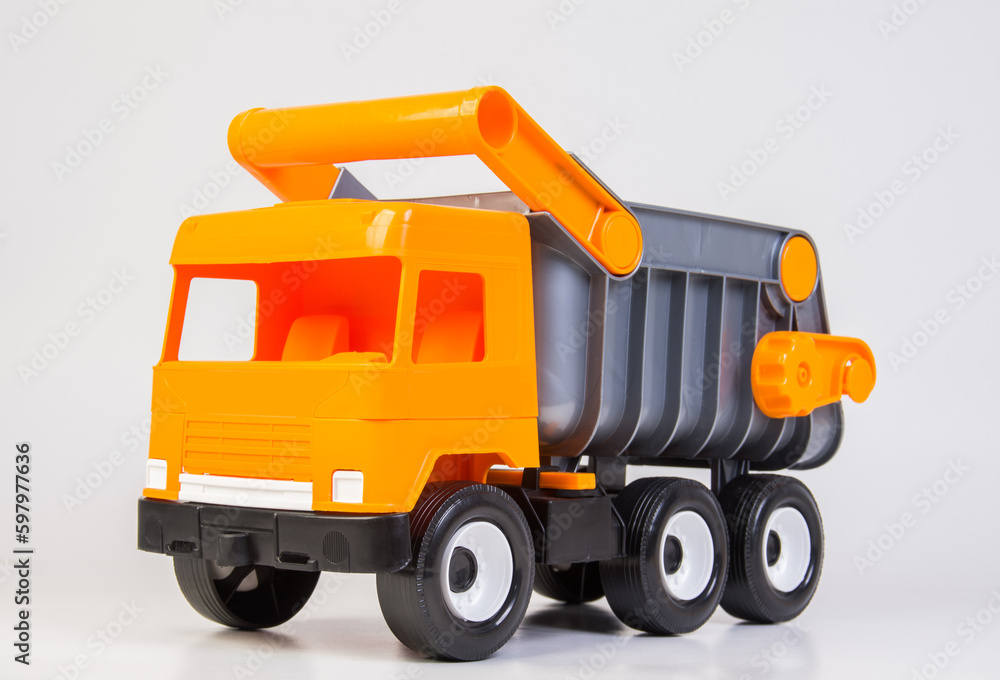 Career truck. Multi-colored children's toys plastic trucks on a white background. Career truck. Multi-colored children's toys plastic trucks on a white background.