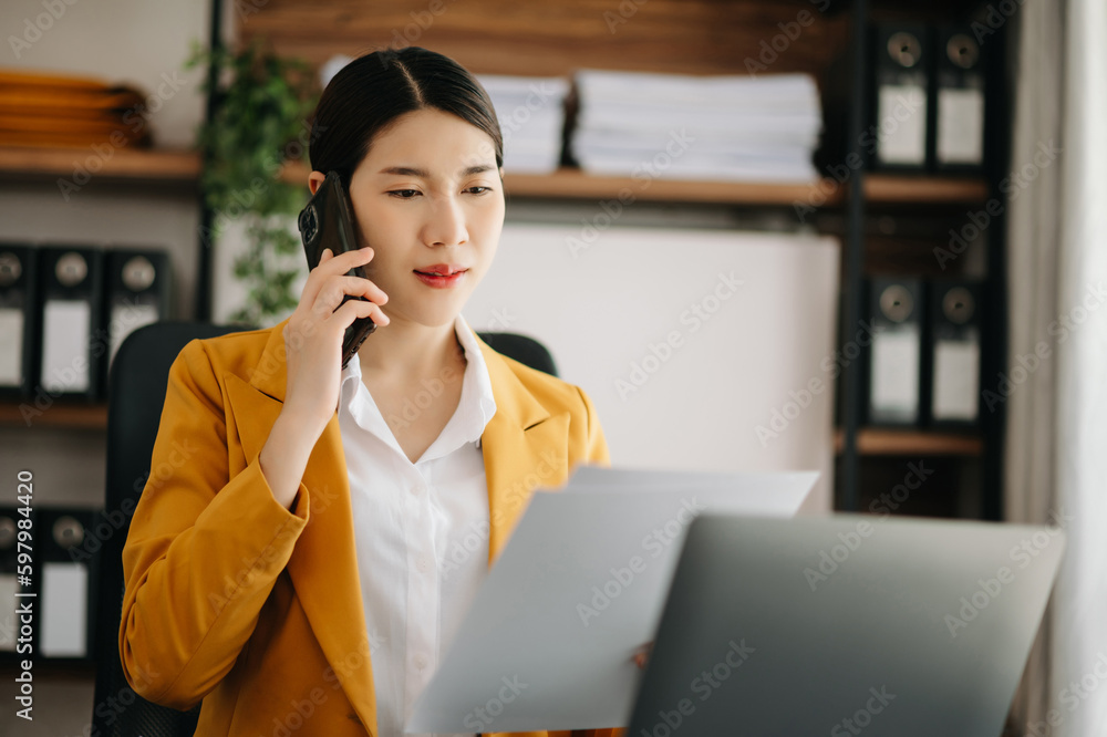 Business woman using tablet and laptop for doing math finance on an office desk, tax, report, accounting, statistics, and analytical research concept in office. Business woman using tablet and laptop for doing math finance on an office desk, tax, report, accounting, statistics, and analytical research concept in office.