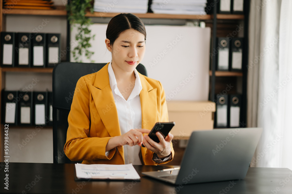Business woman using tablet and laptop for doing math finance on an office desk, tax, report, accounting, statistics, and analytical research concept in office. Business woman using tablet and laptop for doing math finance on an office desk, tax, report, accounting, statistics, and analytical research concept in office.