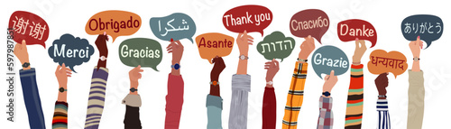 Raised arms and hands of multicultural people from different nations and continents holding speech bubbles with text -thank you- in various international languages.Communication.Equality