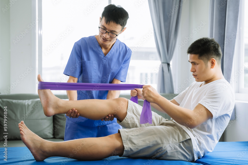 Fototapeta premium Patient at the physiotherapy doing physical exercises with therapist.