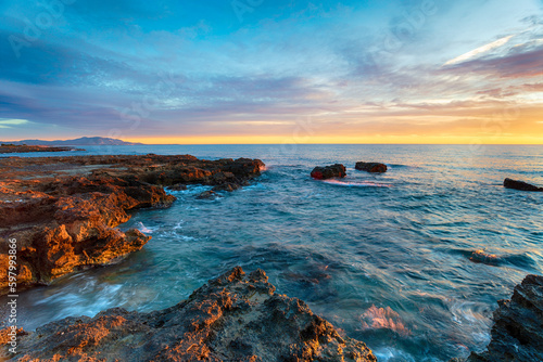 Beautiful sunrise over the mediterranean sea at Torres de la Sal © Helen Hotson
