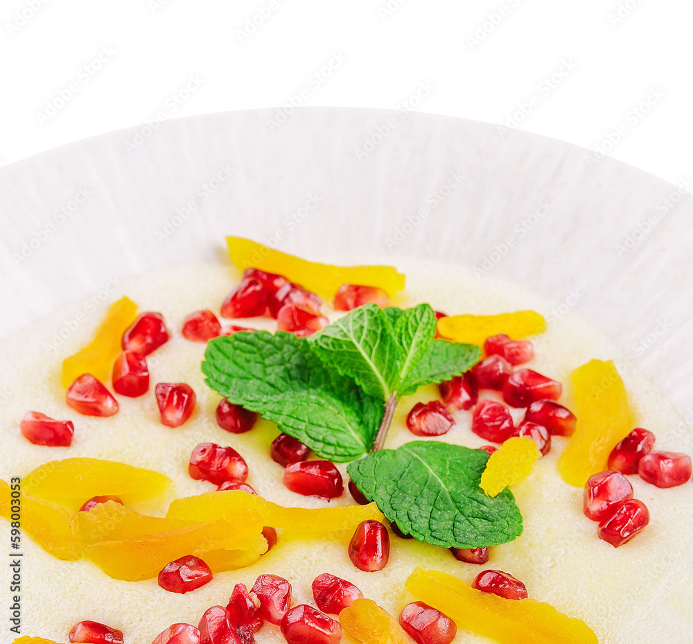Plate of oatmeal with porridge , dried apricots and pomegranates Plate of oatmeal with porridge , dried apricots and pomegranates
