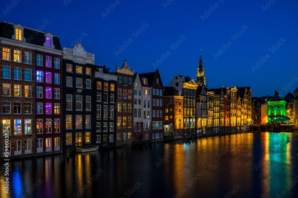 Typical Dutch houses in Amsterdam at night, Holland