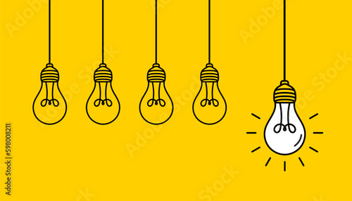 Hanging light bulbs with one glowing on yellow background. Concept of idea