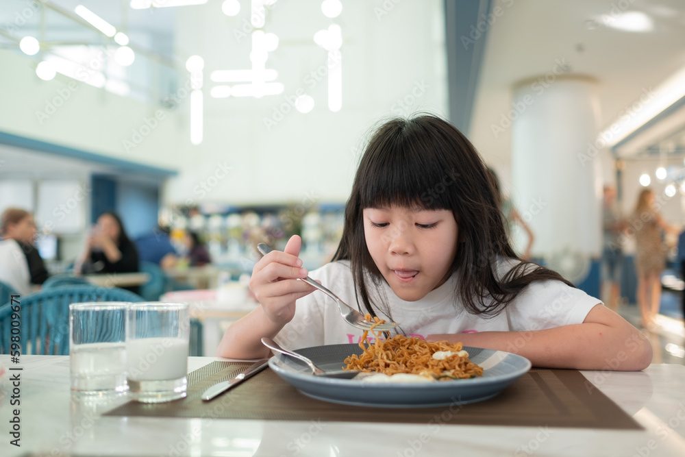 Kid eating food, happy time, breakfast Kid eating food, happy time, breakfast