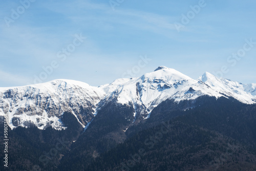 Beautiful snowy peaks of the Caucasus Mountains. Krasnaya Polyana Rosa Khutor Ski Resort  Russia.