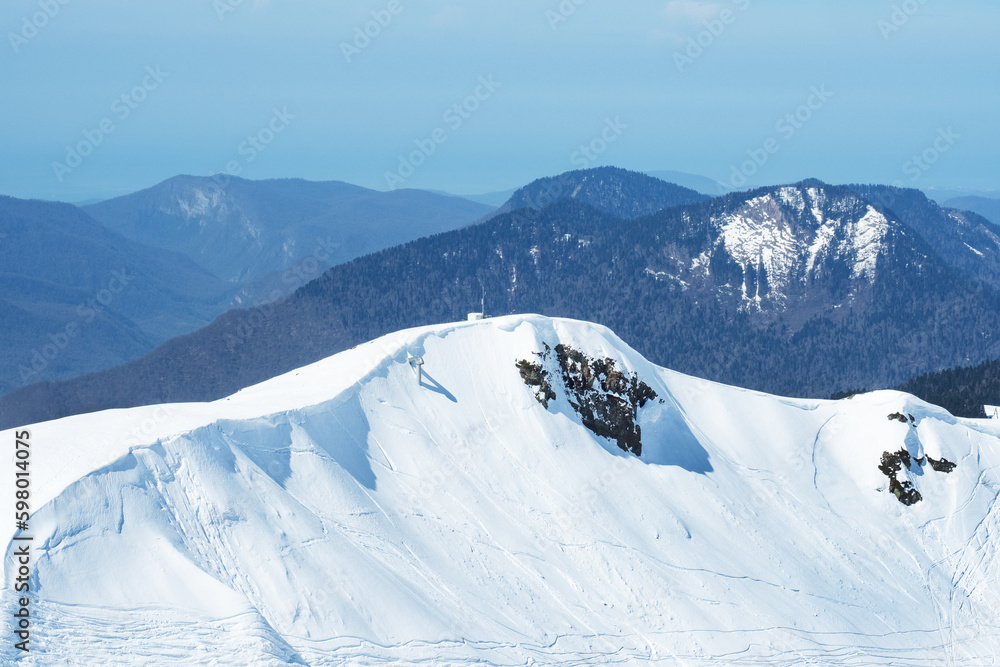 Beautiful snowy peaks of the Caucasus Mountains. Krasnaya Polyana Rosa Khutor Ski Resort, Russia.