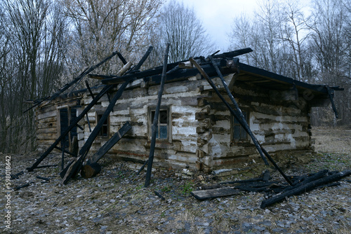 Burned after fire rural Ukrainian house at an abondoned farm photo