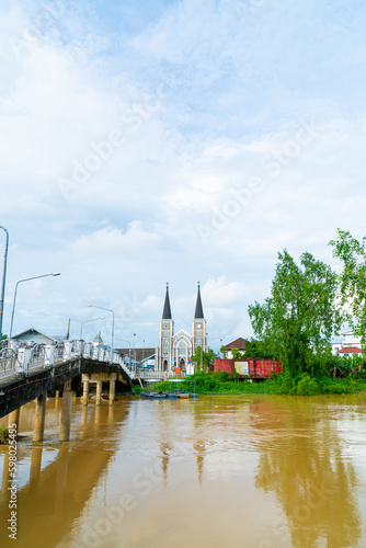 Cathedral of the Immaculate Conception with Niramon bridge at Chanthaburi in Thailand photo