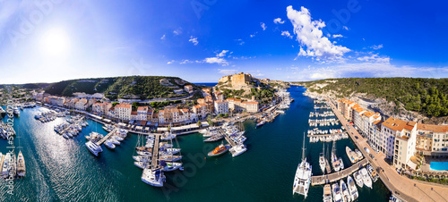 Bonifacio aerial drone panoramic view, Corsica island. view of castle and marina with sailing boats . popular tourist destination, France