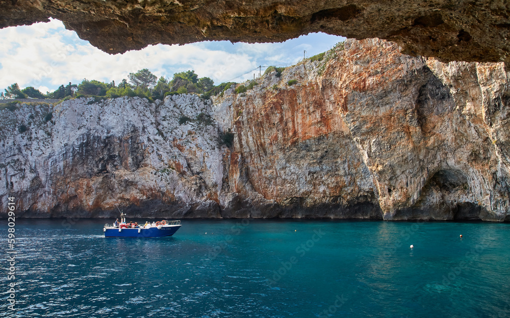 Fototapeta premium Grotta Zinzulusa, Italy - A motorboat at the famous grotto of Zinzulusa