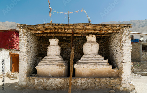 Large Buddhist stupas housed in brick framework outdoors in Nako, India.