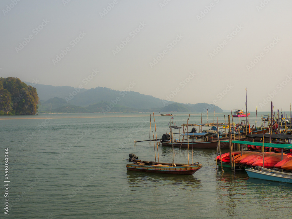 Boats on the lake, Fishing port, transport port for tourism in the coastal bay. with the beautiful scenery of the islands A delightful vacation journey is about to begin.