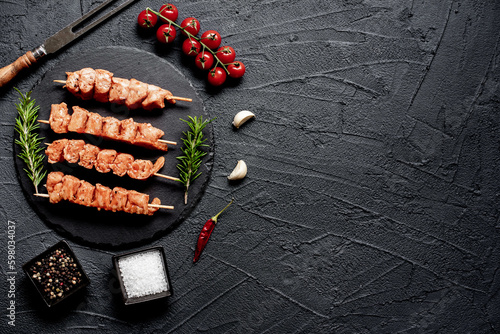 raw turkey skewers on a stone background with copy space for your background