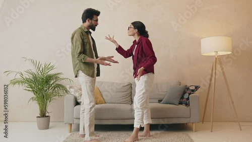 Unhappy indian couple having argument at home Generative AI