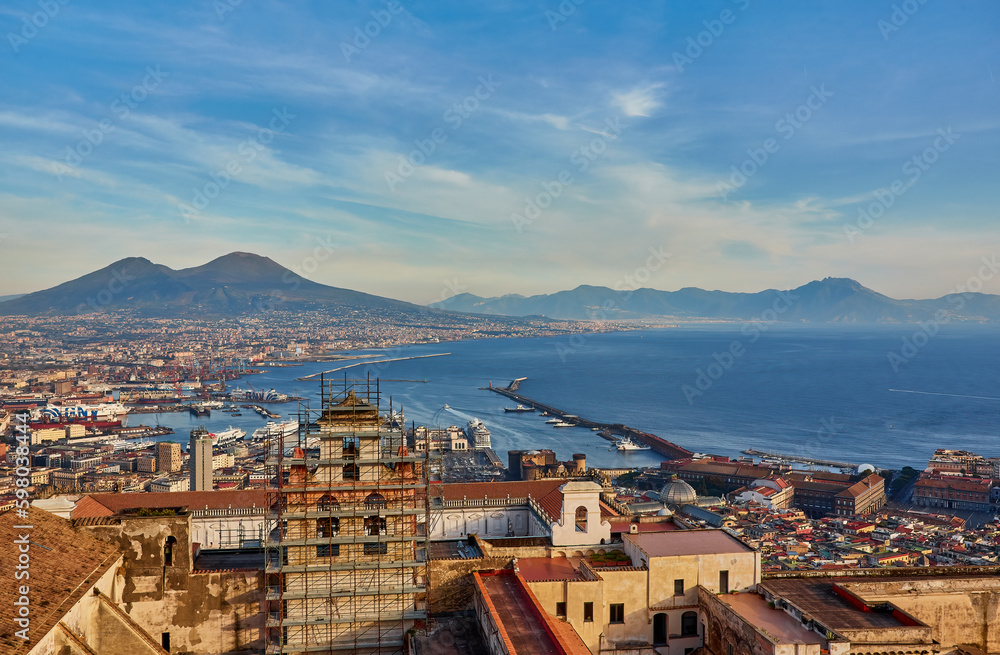 Naples, Italy: Panoramic view of the city and port with Mount Vesuvius on the horizon as seen from the hills of Posilipo.